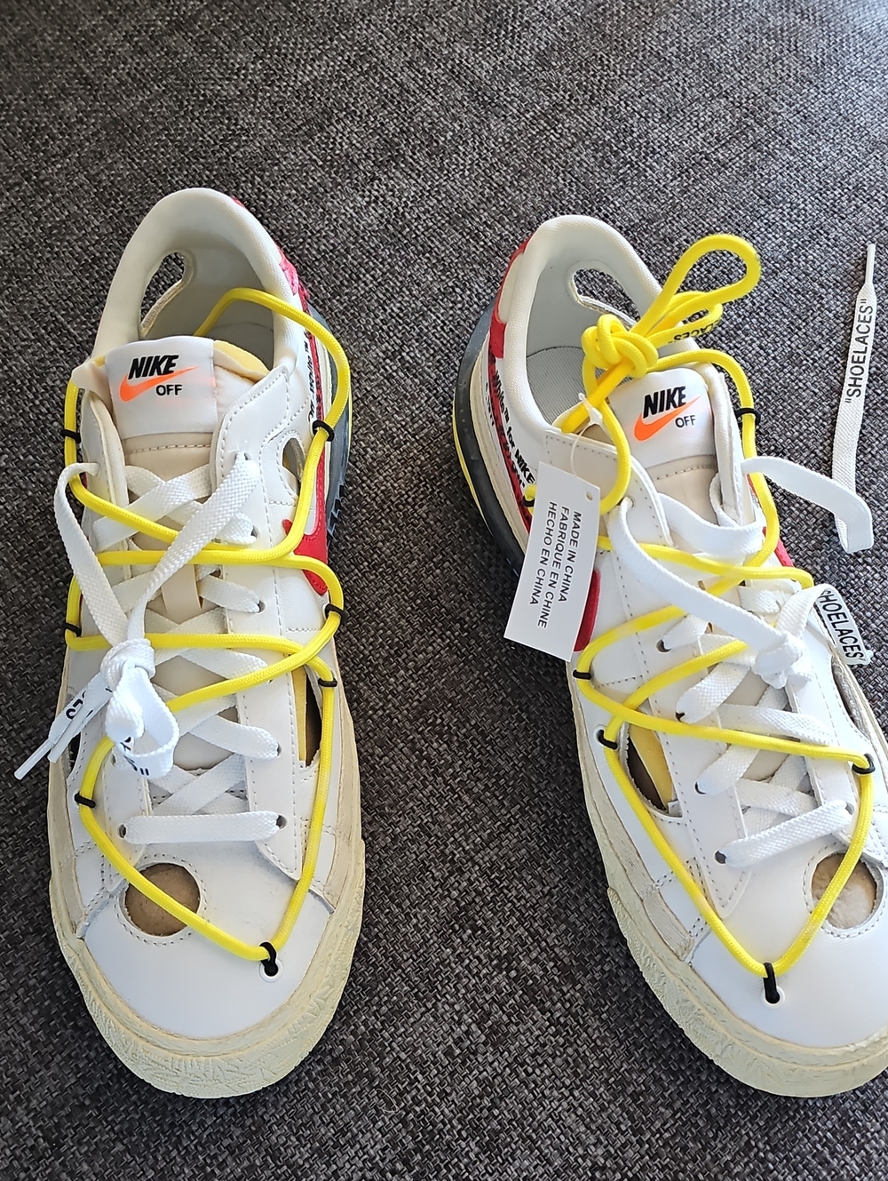 Off-White x Nike White Sneakers with Yellow Laces and Red Heel Detail